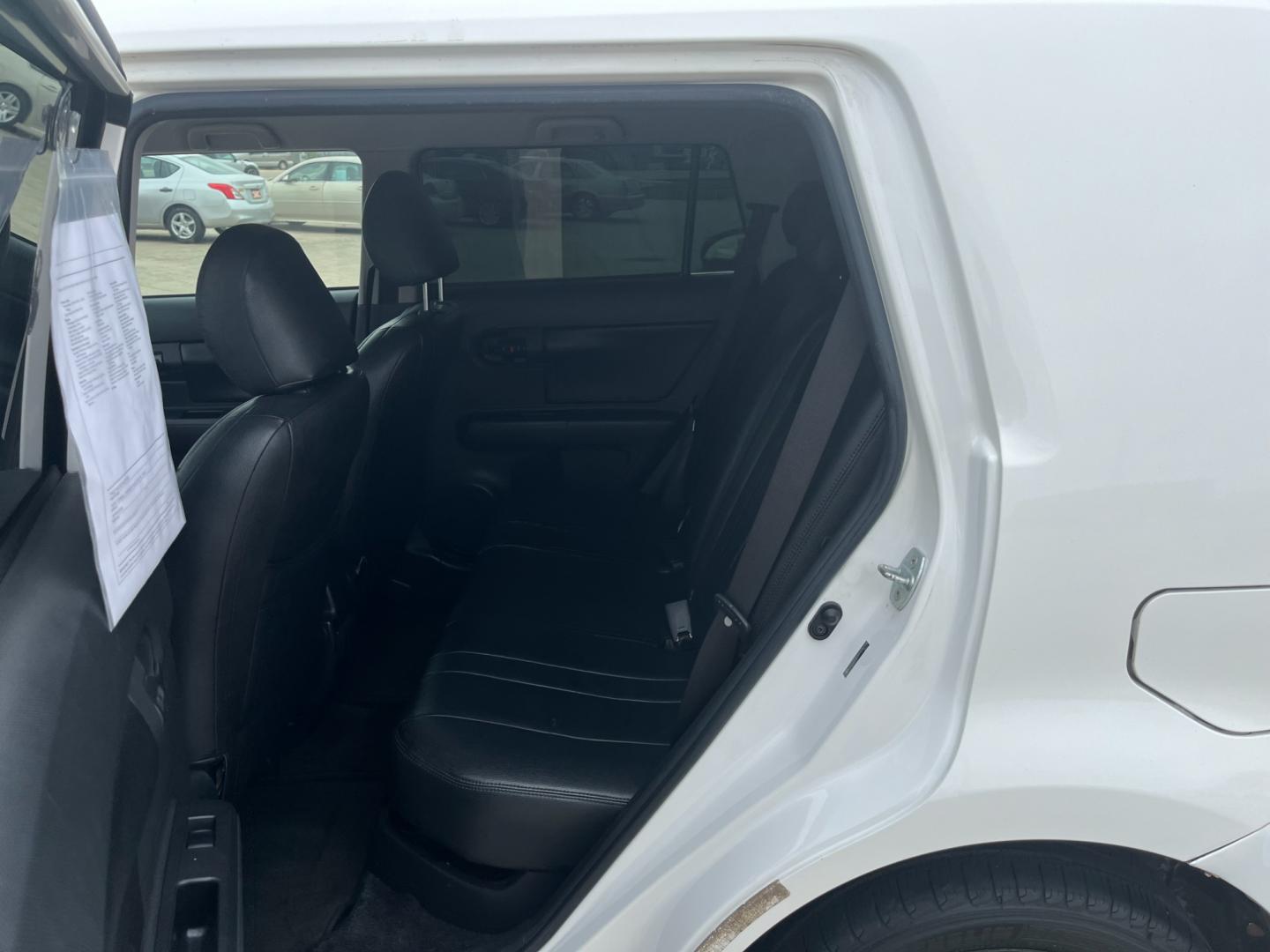 2009 white /black Scion xB Wagon (JTLKE50E591) with an 2.4L L4 DOHC 16V engine, Automatic transmission, located at 14700 Tomball Parkway 249, Houston, TX, 77086, (281) 444-2200, 29.928619, -95.504074 - Photo#9